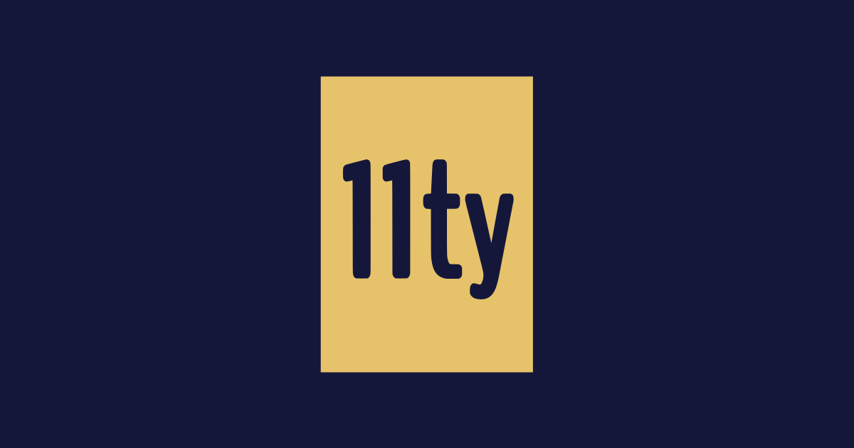 Logo 11ty: znaki 11ty wycięte w złotym prostokącie, na ciemnoniebieskim tle